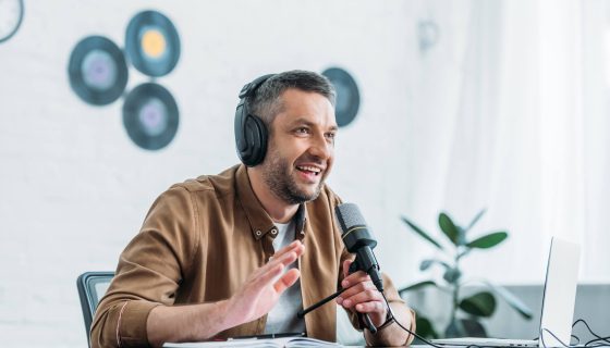 cheerful-radio-host-gesturing-while-recording-podc-2021-09-03-07-42-01-utc.jpg